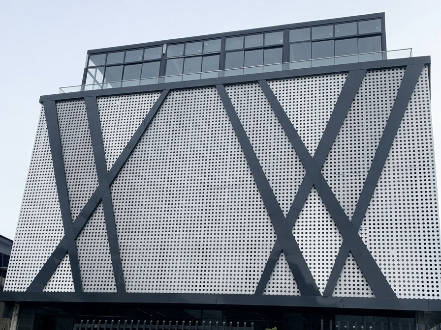 Contemporary building facade featuring symmetrical aluminium windows